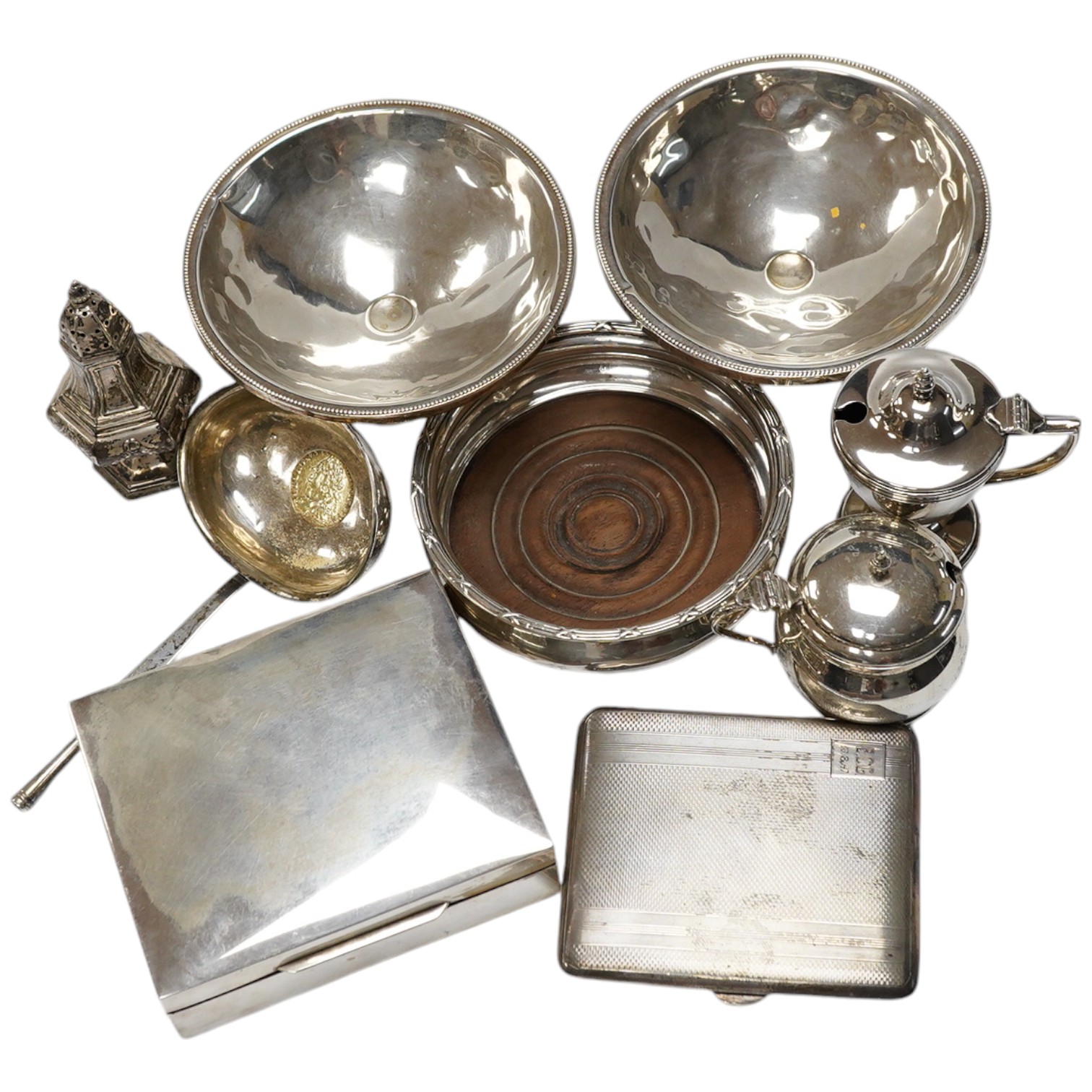 Small silver, sterling and other white metal items including a wine coaster, pair of tazze, mounted cigarette box, condiments, cigarette case etc. Condition - poor to fair